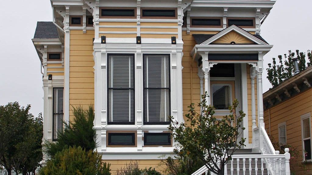 Yellow Victorian cottage with bay windows in Old Town Eureka, California